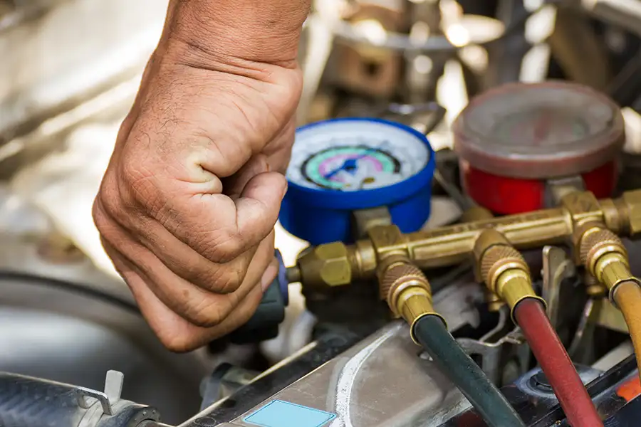 Professional Mechanic providing routine maintenance on car, Air conditioning recharge - Decatur, IL